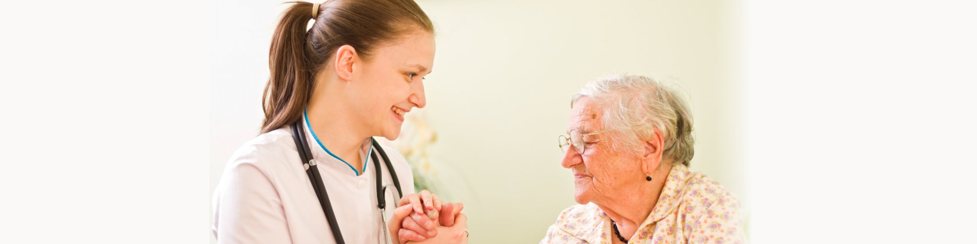 caregiver taking care her elderly